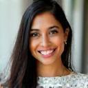 Headshot of Aditi Desai, a small business owner, looking happy and successful.