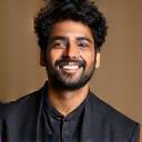 Headshot of Rohan Mehta, a musician, smiling warmly.