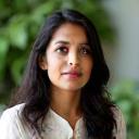 Headshot of Sneha Kapoor, founder of EcoLiving, with a thoughtful expression.